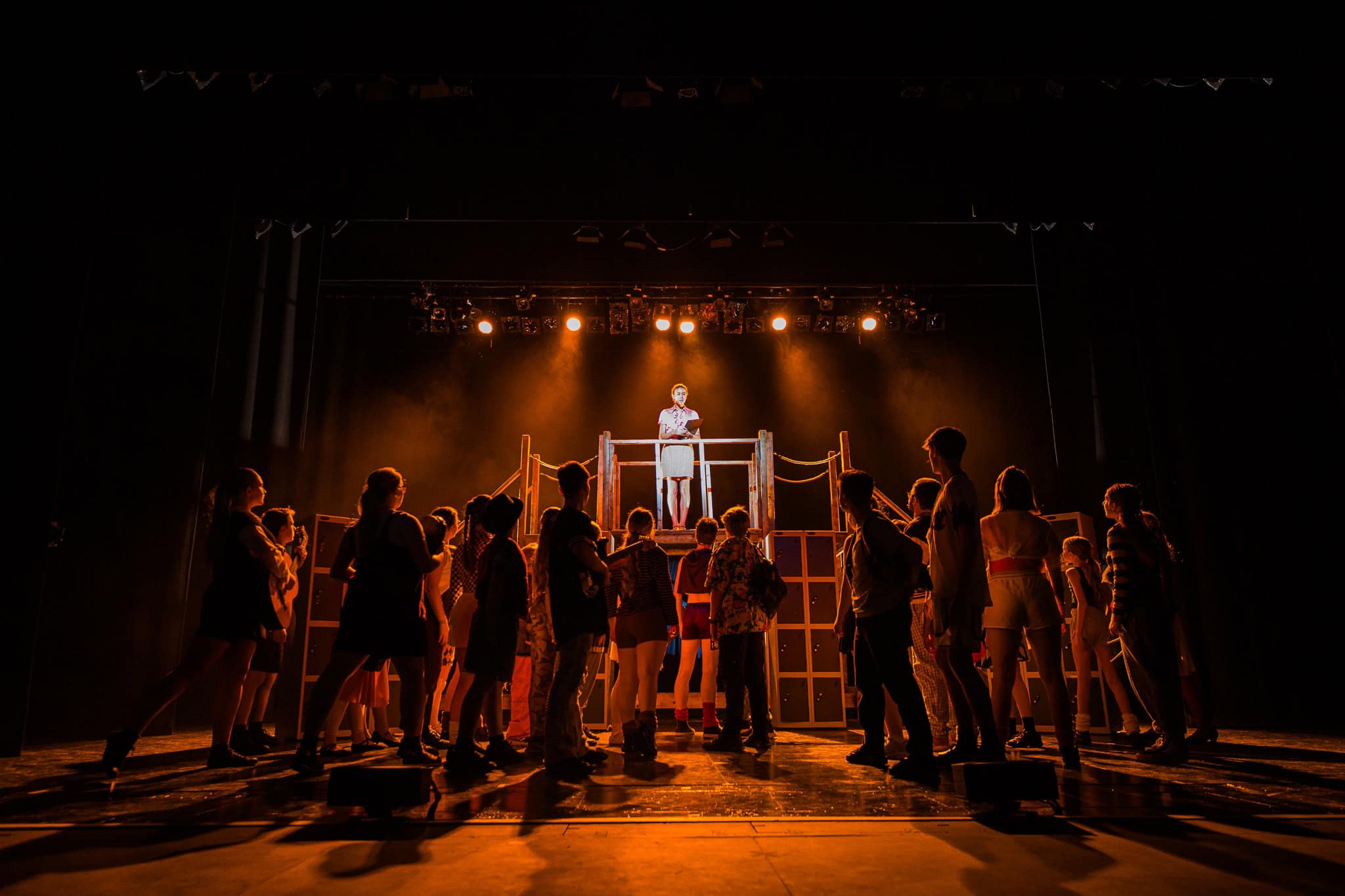 Performers and audience engaging during a theatrical show at LITA.