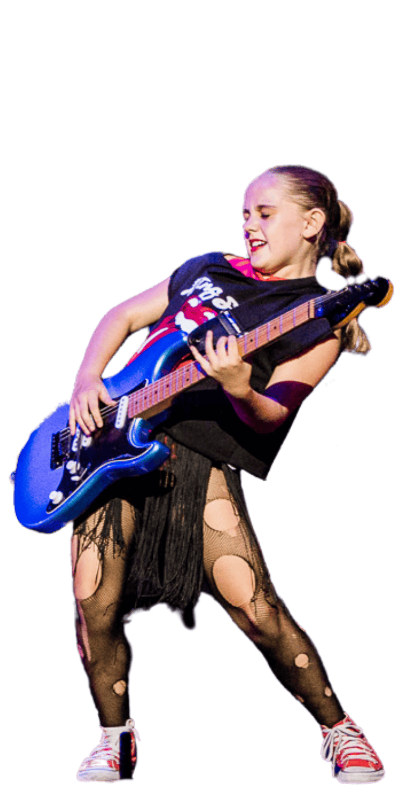 Young girl playing electric guitar on stage.